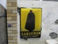 Reality in Scale[SIGN04]本物のエナメル塗り看板 "サンデマン" - 49x34mm